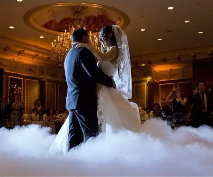 A first dance on a low cloud of fog