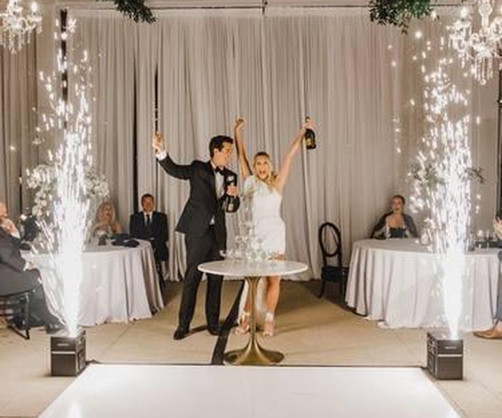 Cold spark fountains framing a couple on the dance floor